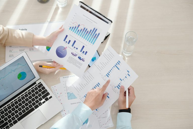 Business People Analyzing Report