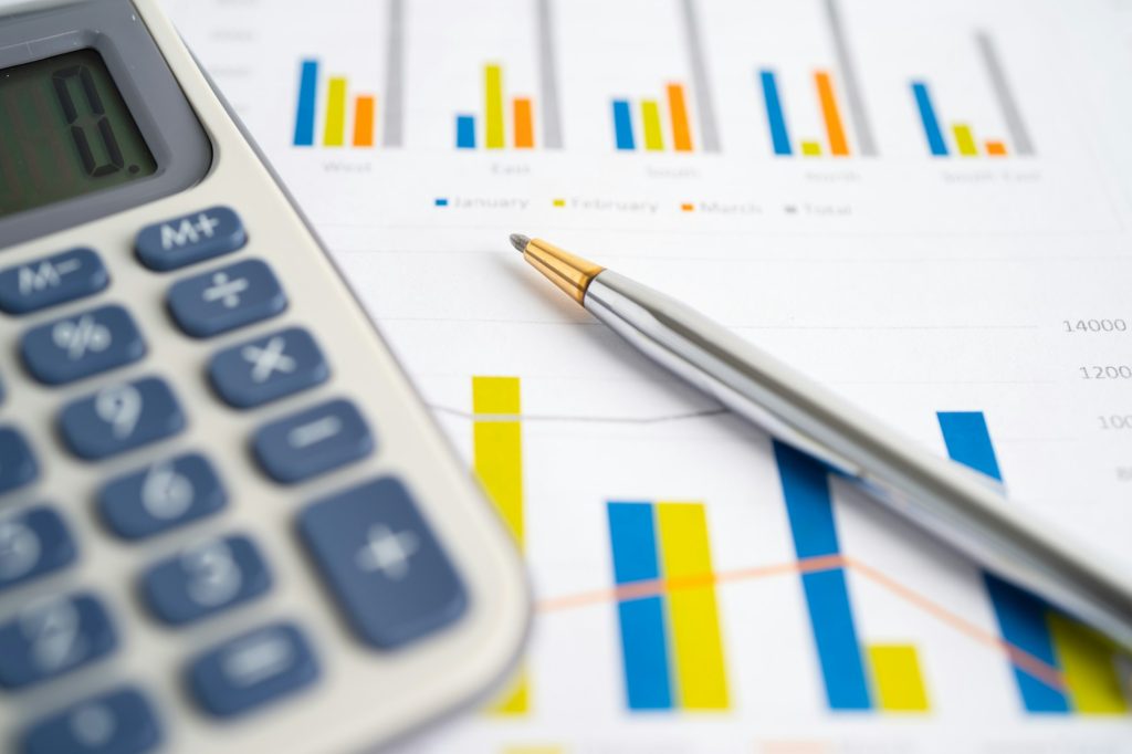 Calculator on graph paper. Finance development, Banking Account, Statistics, Investment
